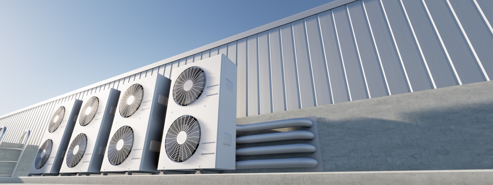 Industrial air conditioning units on rooftop for HVAC solutions.