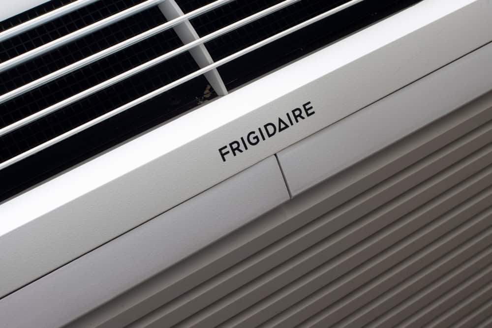 Close-up of a white Frigidaire air conditioner unit, showing the brand name and vent grilles—ideal for those seeking reliable HVAC contractor services in New York City.